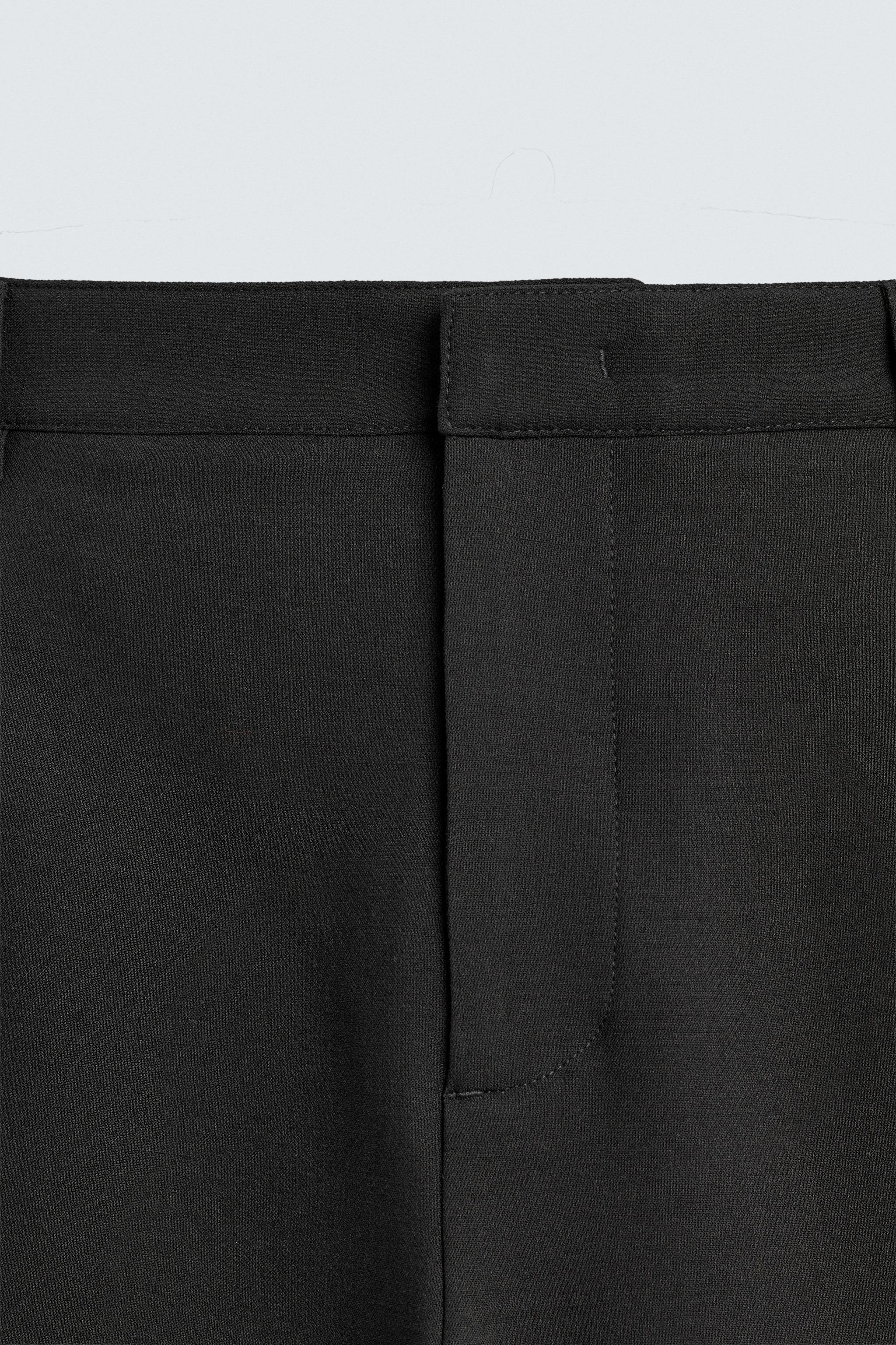 RELAXED FIT PLEATED PANTS